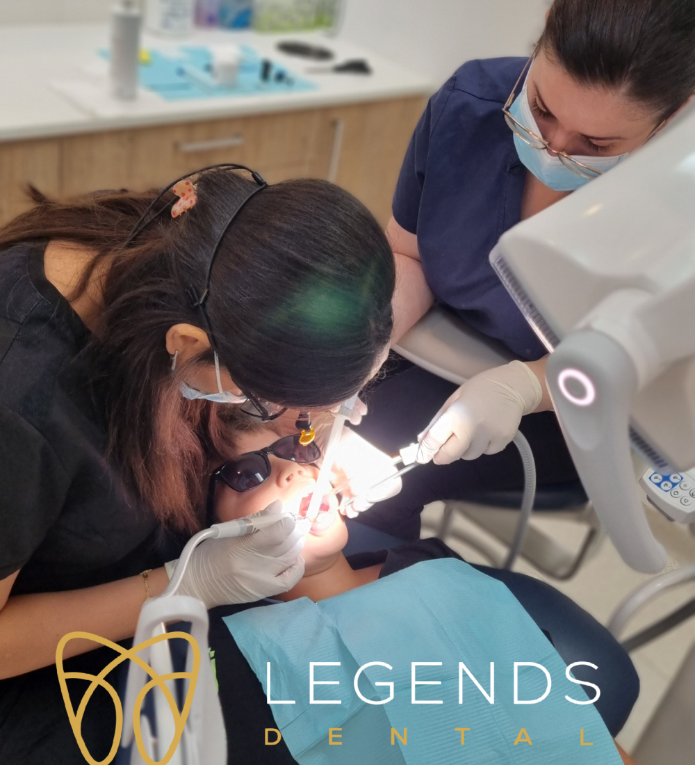 Dr. Rouba Slaiman treating kids at Legends Dental